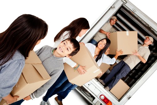 Removal van and moving team working in a Barnet residential street