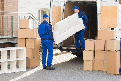 Professional movers loading furniture for a Barnet relocation