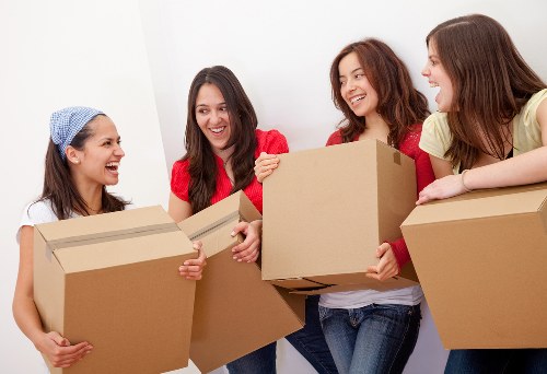 Local movers handling furniture in a Barnet home move