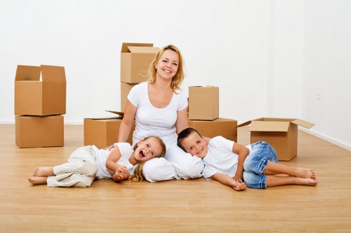 Packed office boxes and equipment ready for a local relocation