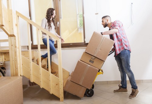 Furniture and packed boxes prepared for a Barnet removal service