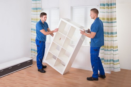 Careful loading of office desks and IT equipment for transport