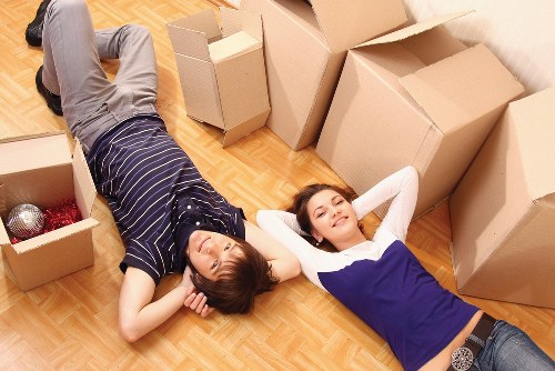 Careful wrapping of fragile household items during a packing service